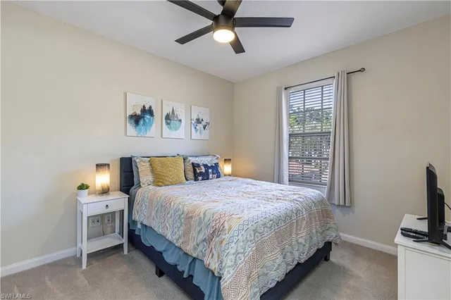 a bedroom with furniture and a window