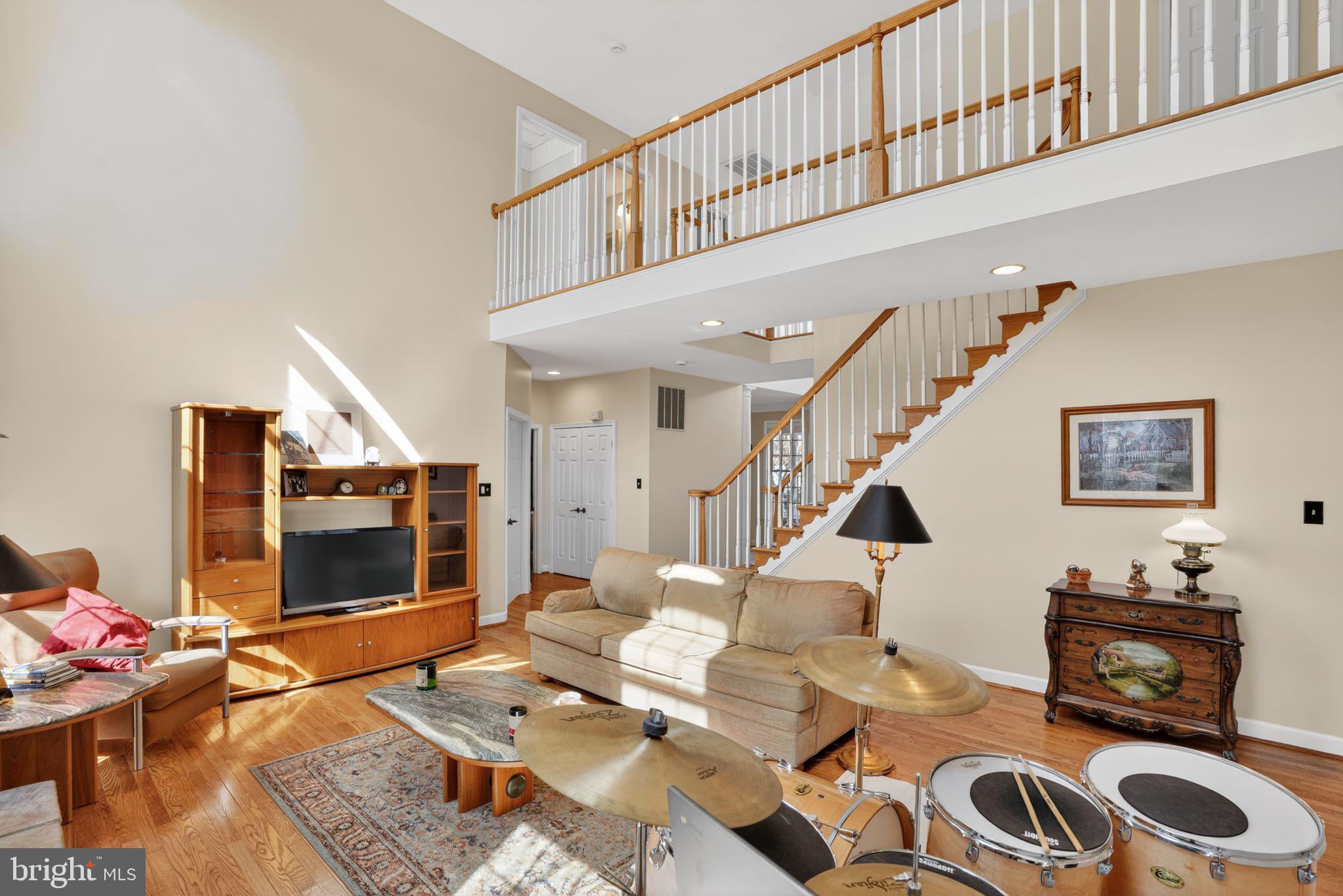 5044 Jericho Road Columbia, MD 21044 - Photo 3 of 67 !st floor family room, cathedral ceilings/stone FP