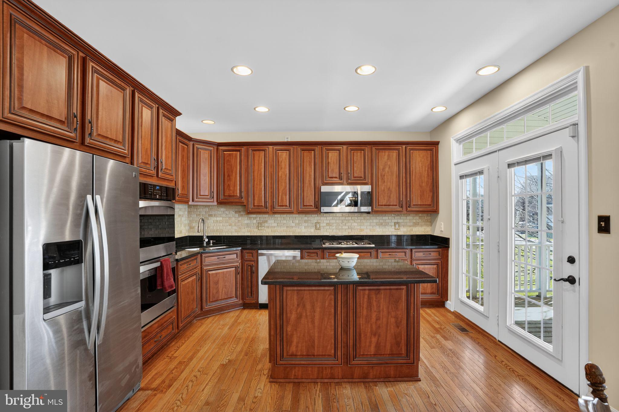 5044 Jericho Road Columbia, MD 21044 - Photo 5 of 67 Enjoy dining on your Veranda (screened in) to back