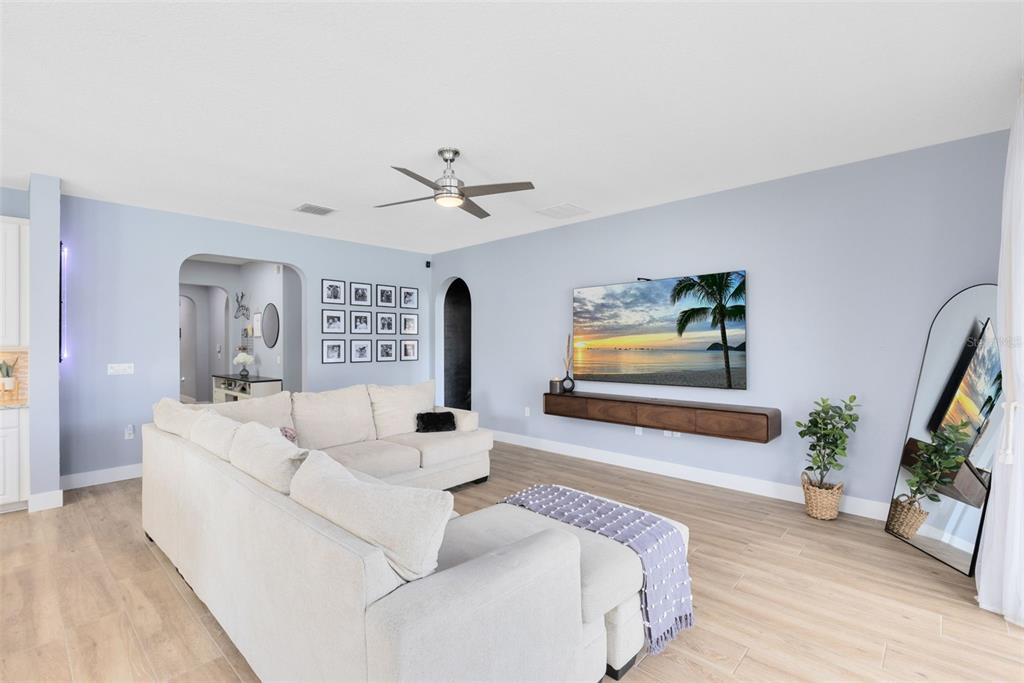 1048 Fountain Coin Loop Orlando, FL 32828 - Photo 14 of 39 a living room with furniture and a flat screen tv