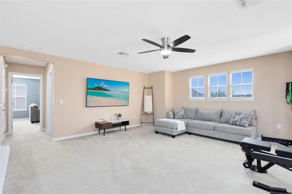 1048 Fountain Coin Loop Orlando, FL 32828 - Photo 24 of 39 a living room with furniture and a chandelier