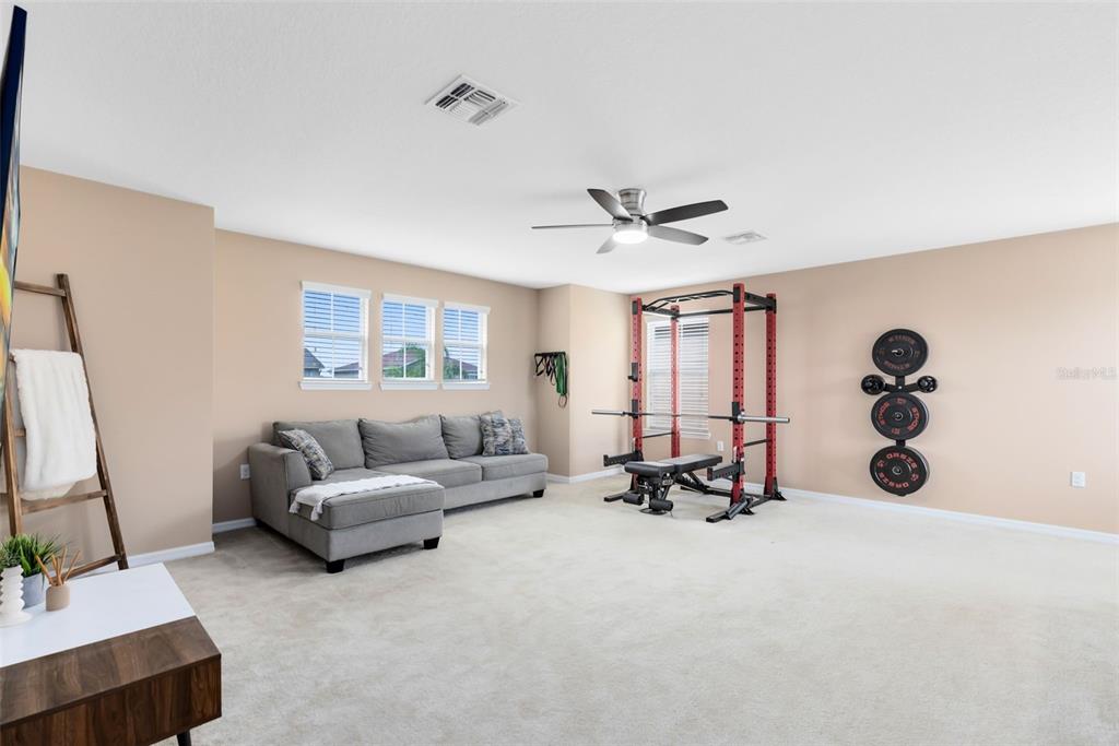 1048 Fountain Coin Loop Orlando, FL 32828 - Photo 26 of 39 a view of living room with furniture and a large window