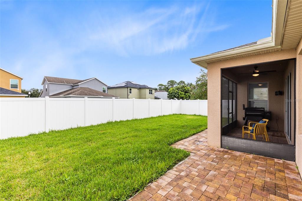 1048 Fountain Coin Loop Orlando, FL 32828 - Photo 31 of 39 a view of a backyard of the house