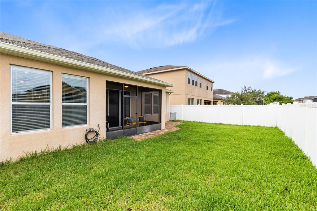 1048 Fountain Coin Loop Orlando, FL 32828 - Photo 33 of 39 a view of a house with backyard garden and garden