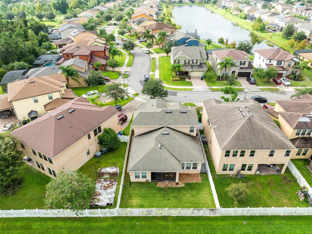 1048 Fountain Coin Loop Orlando, FL 32828 - Photo 36 of 39 an aerial view of a house with a yard