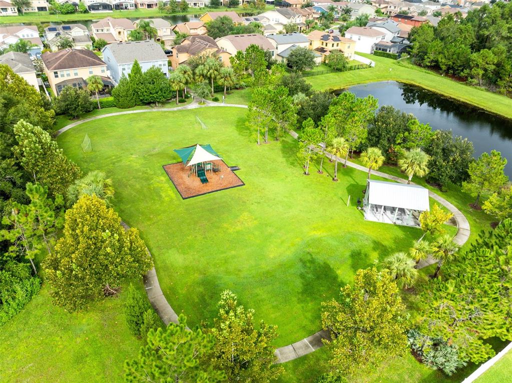 1048 Fountain Coin Loop Orlando, FL 32828 - Photo 38 of 39 a view of a garden with a lake view