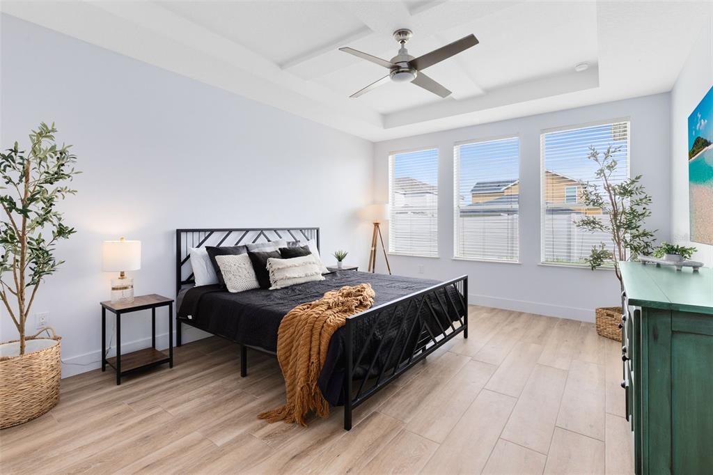 1048 Fountain Coin Loop Orlando, FL 32828 - Photo 5 of 39 a bed room with a bed and a couch