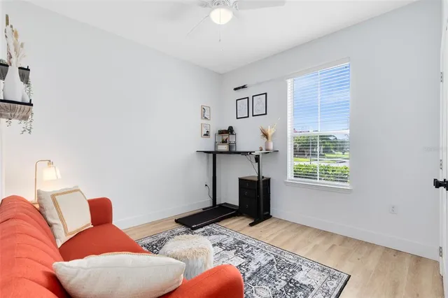 a bedroom with furniture and a window