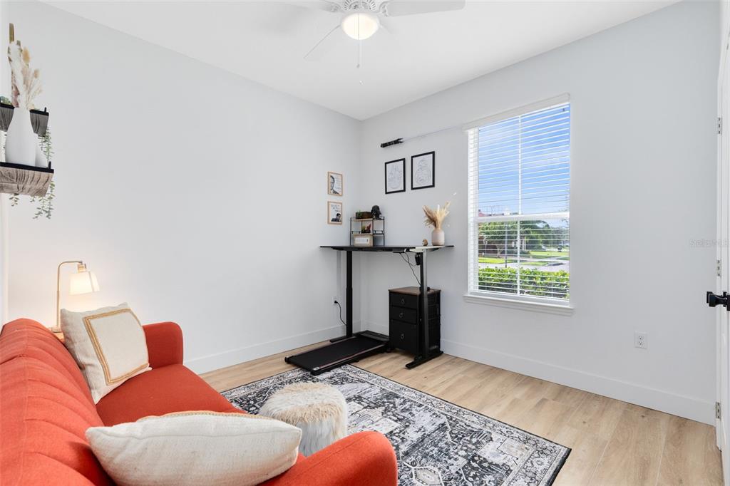 1048 Fountain Coin Loop Orlando, FL 32828 - Photo 8 of 39 a bedroom with furniture and a window