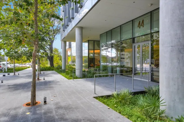 a view of a chair and table in backyard of the house