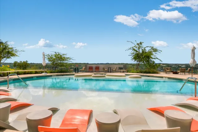 a large living room with furniture and a large window