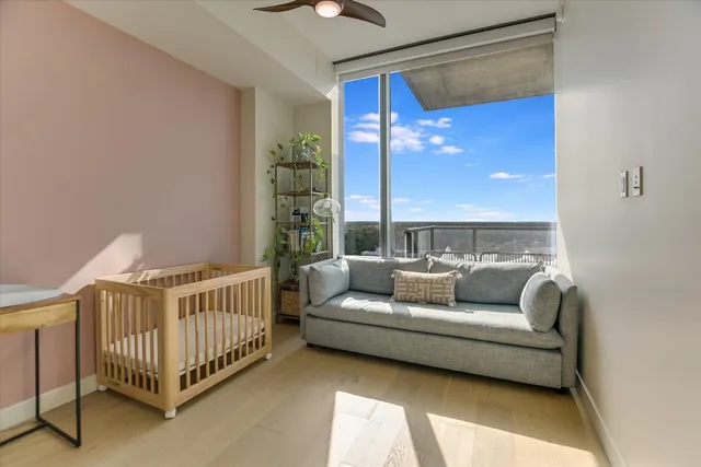 a balcony with furniture and wooden floor