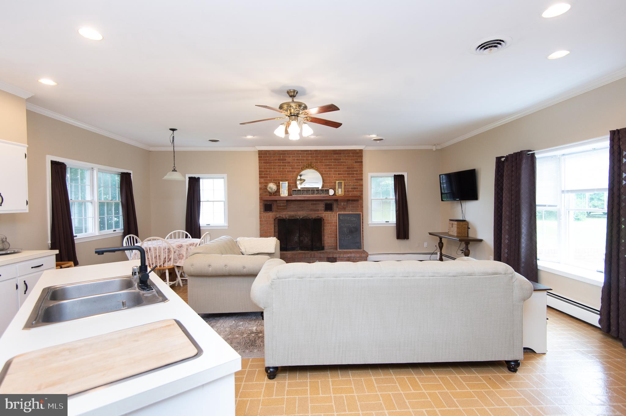 6365 Palmer Mill Road Hurlock, MD 21643 - Photo 6 of 56 Kitchen/family room with wood burning fireplace