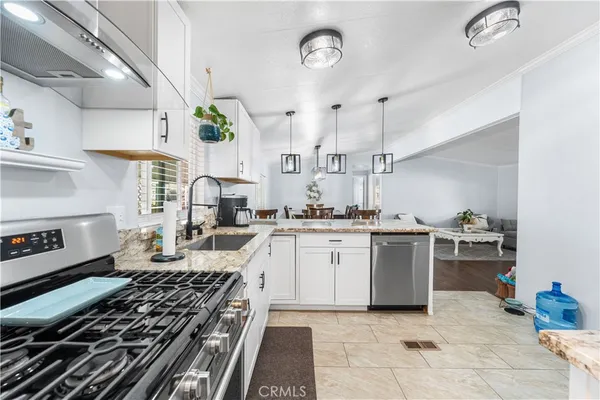 a kitchen with a stove and a sink