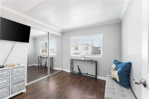 a view of workspace with furniture window and wooden floor