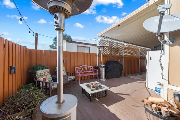 a living room with furniture and a mirror