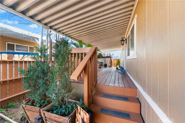 a view of balcony with furniture