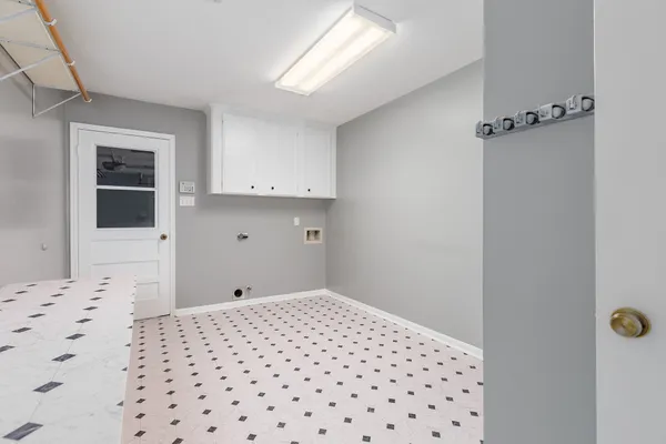 a bedroom with a bed and cabinets