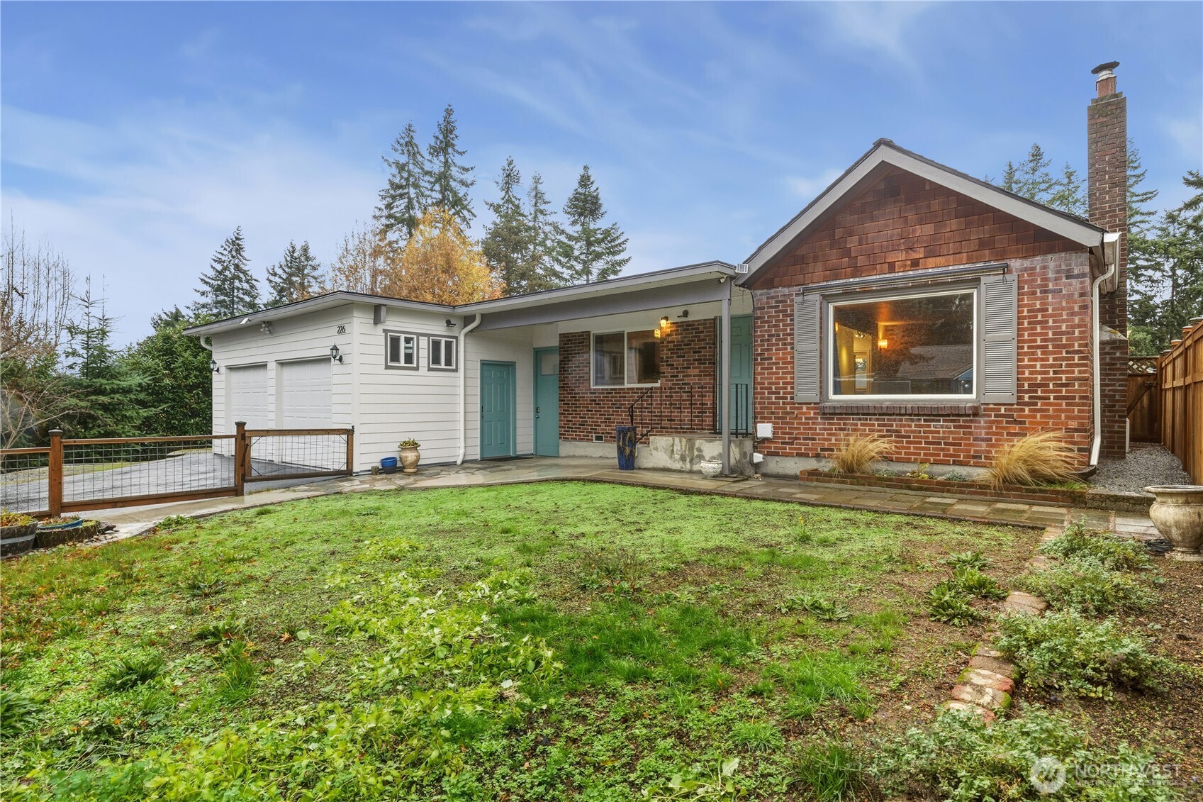 a front view of house with yard and green space