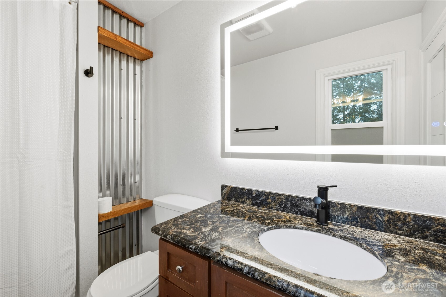 226 Southwest 131st Street Burien, WA 98146 - Photo 12 of 25 a bathroom with a sink toilet and a mirror