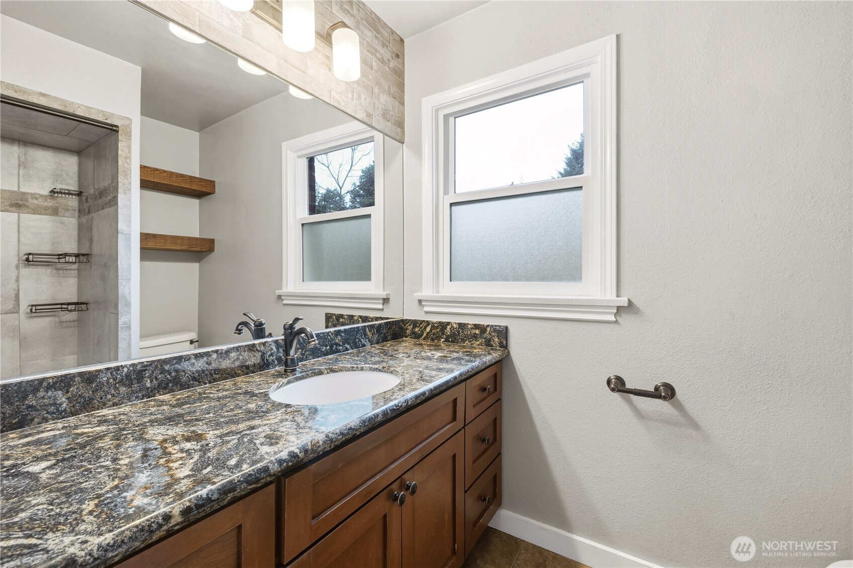 226 Southwest 131st Street Burien, WA 98146 - Photo 13 of 25 a bathroom with a granite countertop sink and a mirror