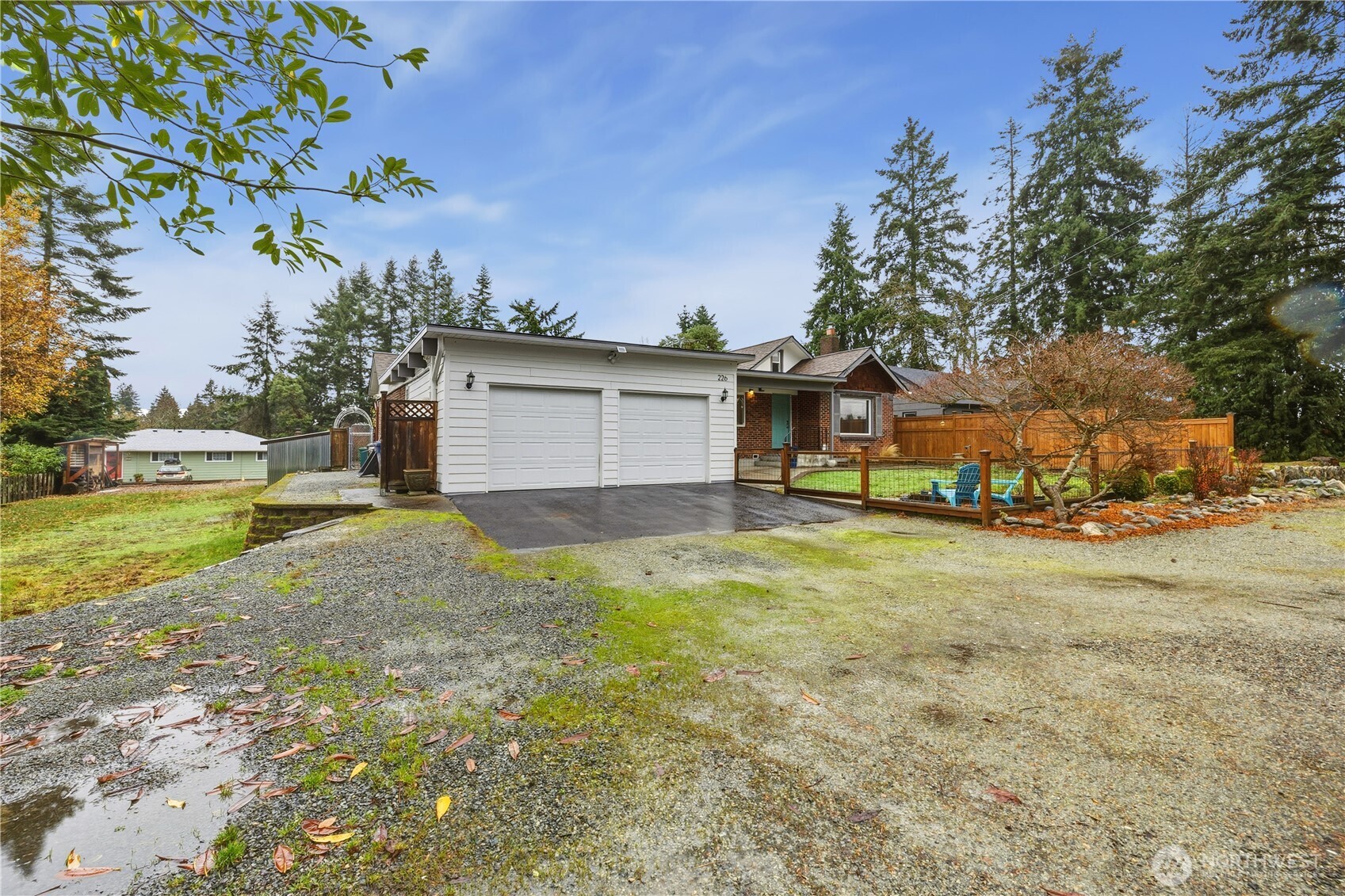 226 Southwest 131st Street Burien, WA 98146 - Photo 24 of 25 a view of a house with a yard and garage
