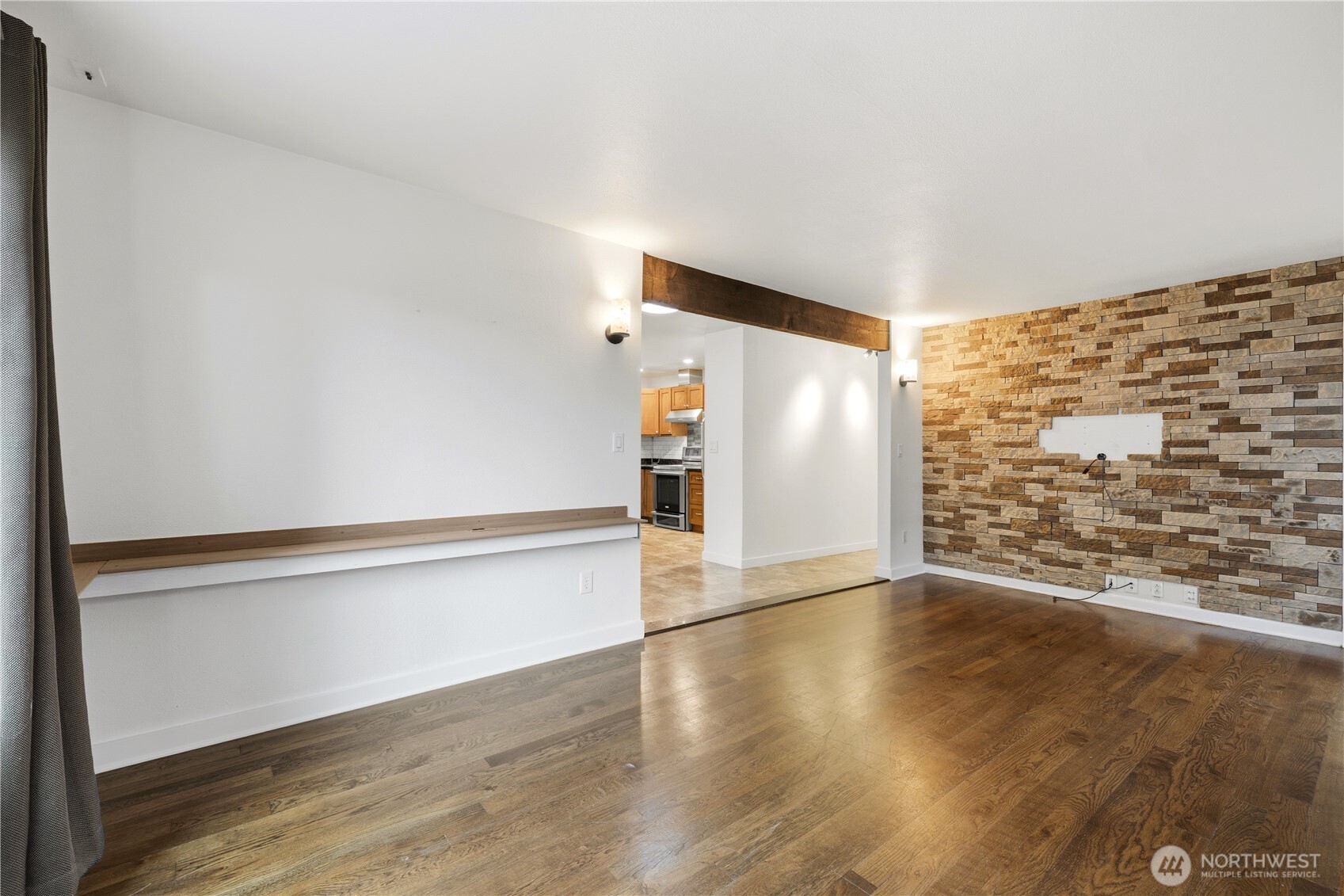 226 Southwest 131st Street Burien, WA 98146 - Photo 3 of 25 a view of an empty room with wooden floor and stairs