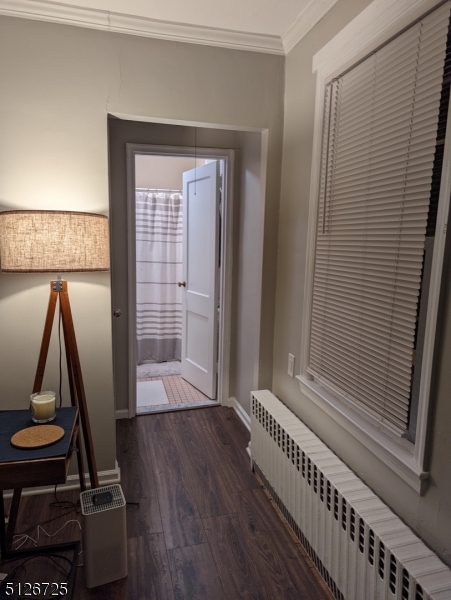 18 The Crescent, Unit 8 Montclair, NJ 07042 - Photo 6 of 8 a view of an empty room with wooden floor and a window