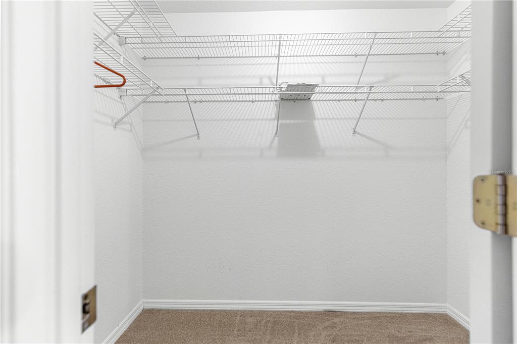 6115 Southwest 104th Street Ocala, FL 34476 - Photo 20 of 39 a view of a room with racks on the wall