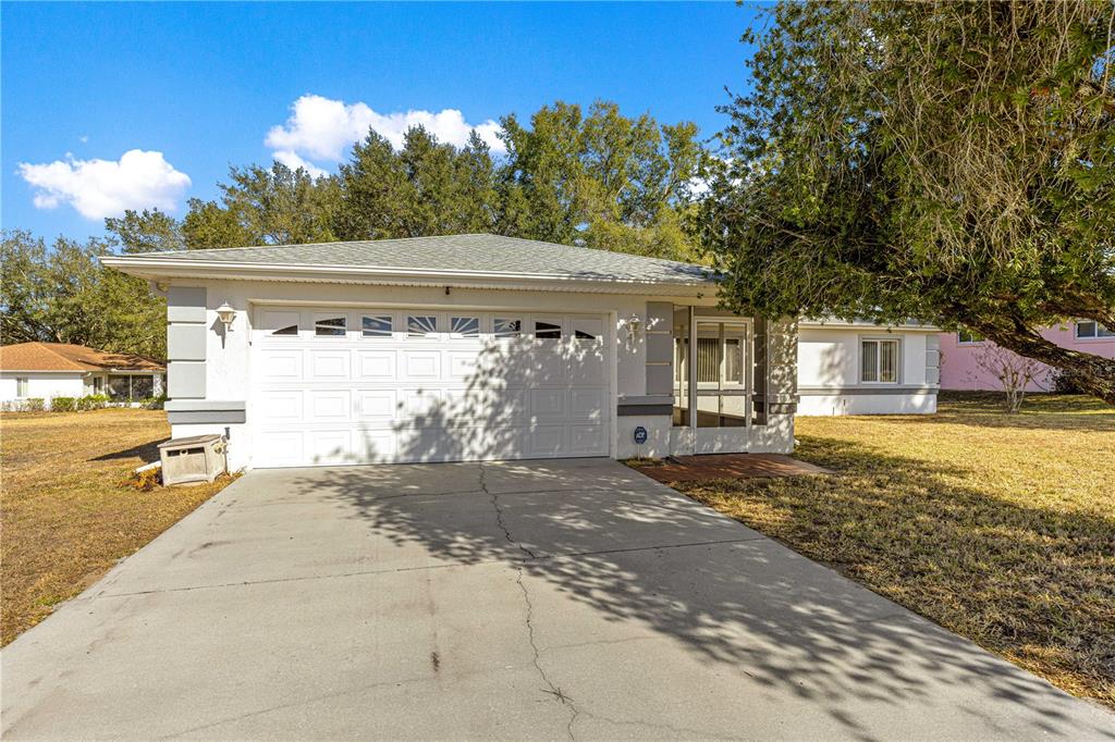 6115 Southwest 104th Street Ocala, FL 34476 - Photo 2 of 39 a view of a house with a outdoor space