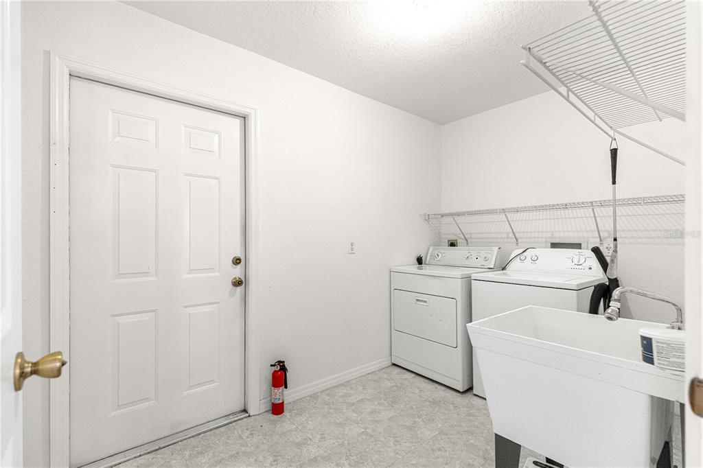 6115 Southwest 104th Street Ocala, FL 34476 - Photo 27 of 39 a utility room with dryer and washer