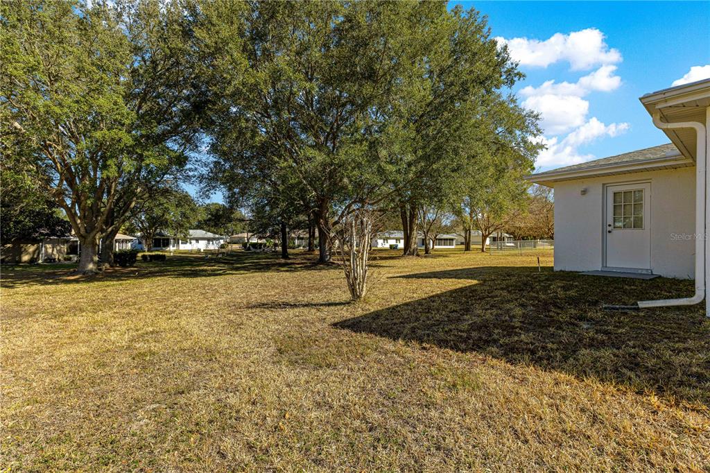 6115 Southwest 104th Street Ocala, FL 34476 - Photo 30 of 39 a view of outdoor space with garden