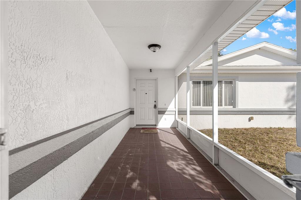 6115 Southwest 104th Street Ocala, FL 34476 - Photo 3 of 39 a view of a large white room with wooden floor