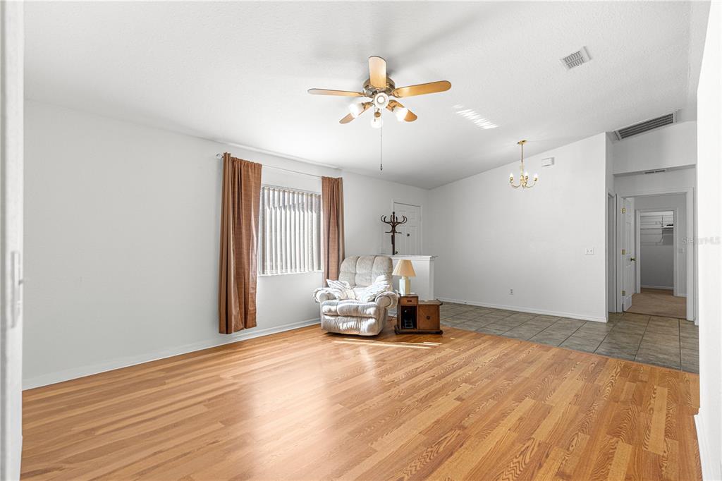 6115 Southwest 104th Street Ocala, FL 34476 - Photo 7 of 39 a view of a room with a window and wooden floor