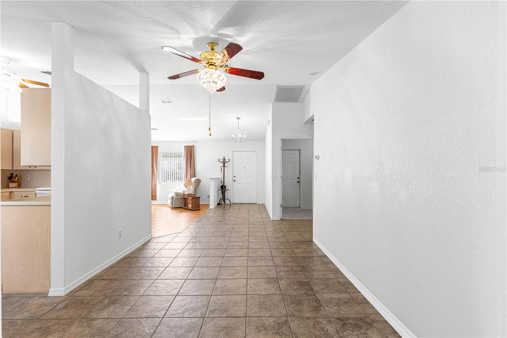 6115 Southwest 104th Street Ocala, FL 34476 - Photo 9 of 39 a view of a livingroom with a ceiling fan and window