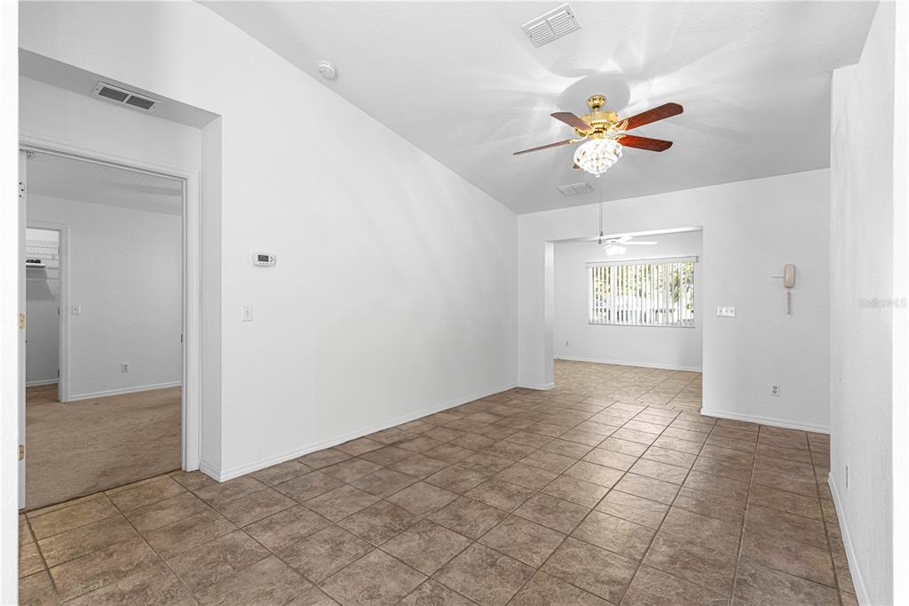 6115 Southwest 104th Street Ocala, FL 34476 - Photo 10 of 39 an empty room with windows and fan