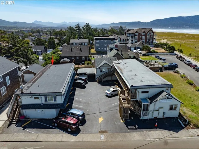 an aerial view of a house with a ocean view