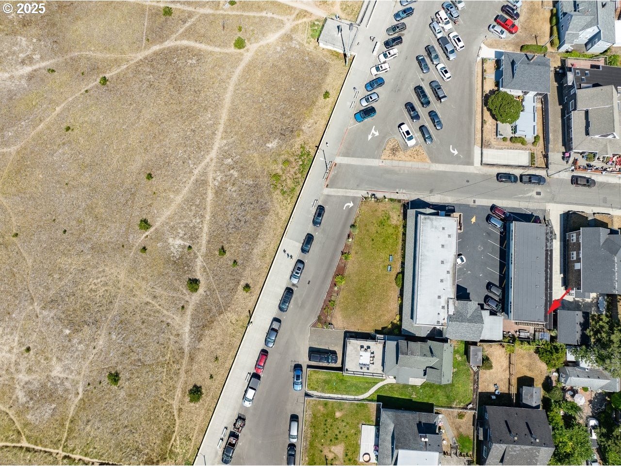 1022 North Prom Tradewinds, Unit 208 Seaside, OR 97138 - Photo 29 of 34 a building with an outdoor space