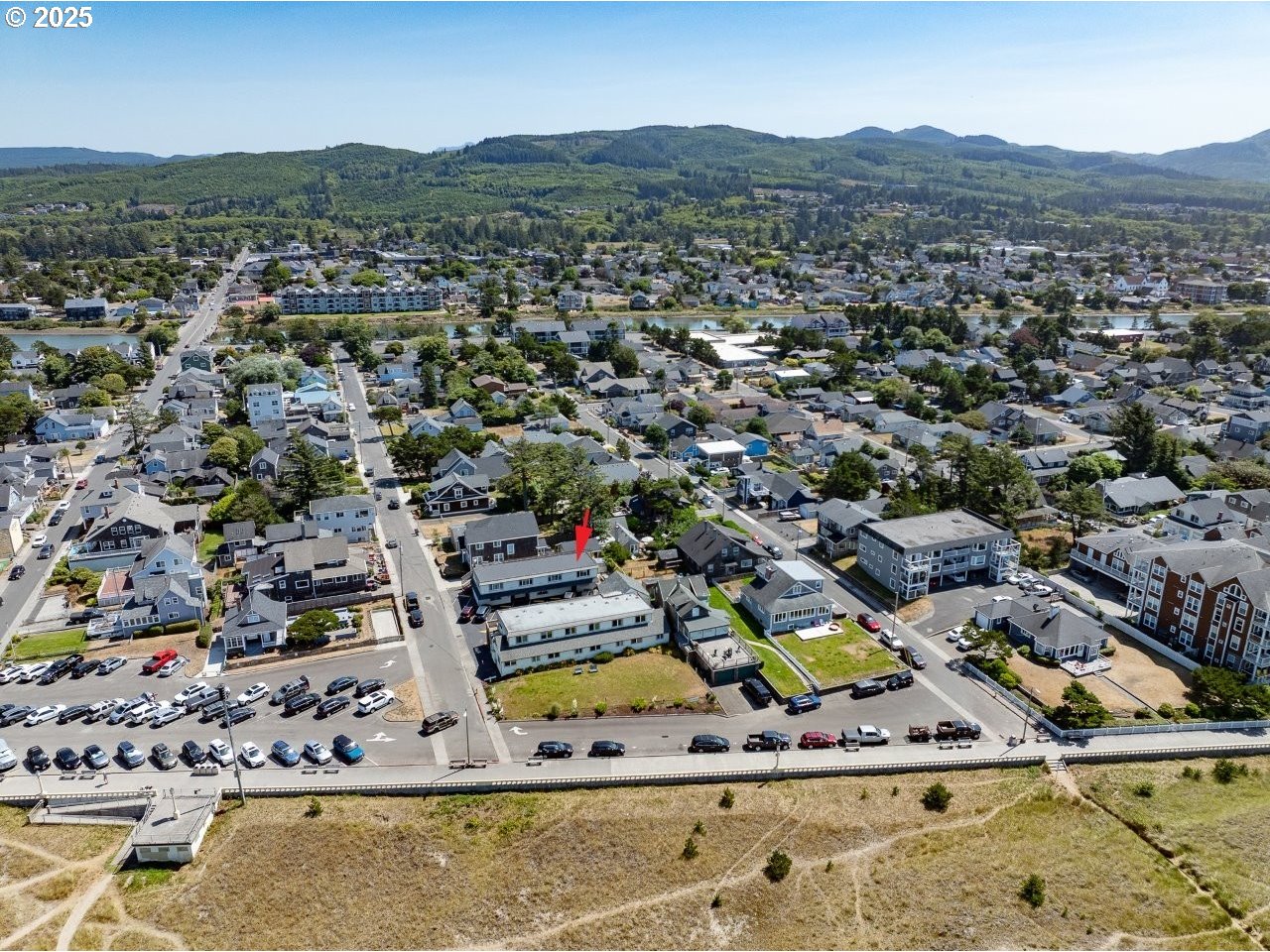 1022 North Prom Tradewinds, Unit 208 Seaside, OR 97138 - Photo 30 of 34 an aerial view of residential houses with outdoor space