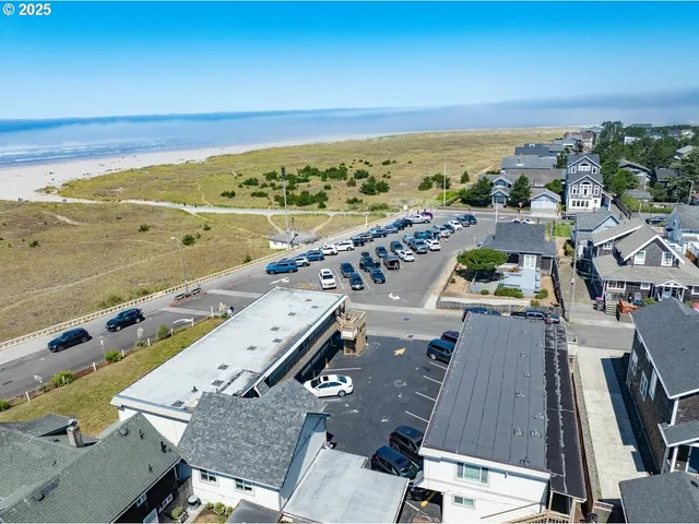 an aerial view of residential building with beach