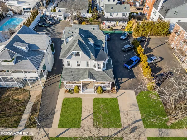 an aerial view of residential houses with outdoor space