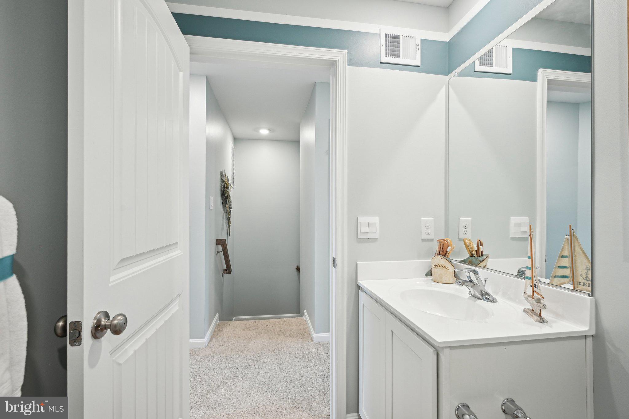 515 Colette Street Ellendale, DE 19941 - Photo 23 of 30 a bathroom with a sink and a mirror