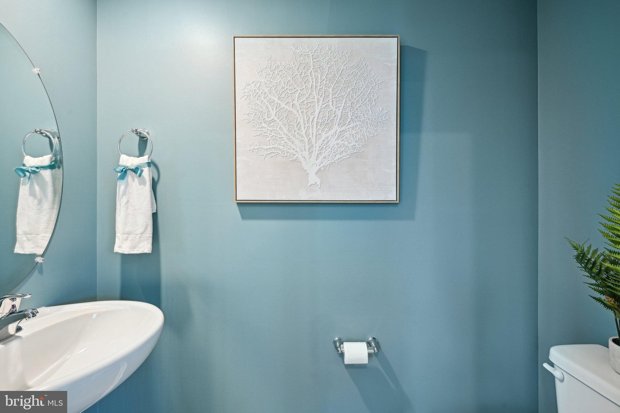515 Colette Street Ellendale, DE 19941 - Photo 29 of 30 a bathroom with a toilet and a sink