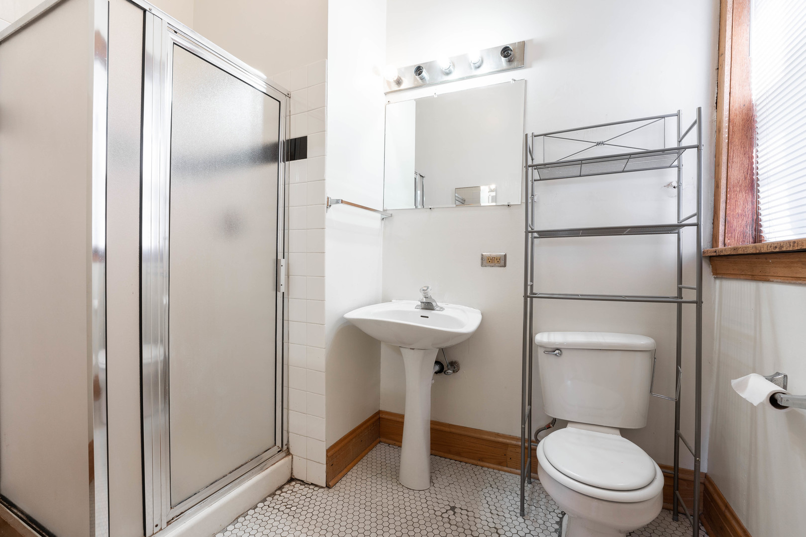 4060 North Sheridan Road, Unit 3S Chicago, IL 60613 - Photo 14 of 15 a bathroom with a sink a toilet and shower