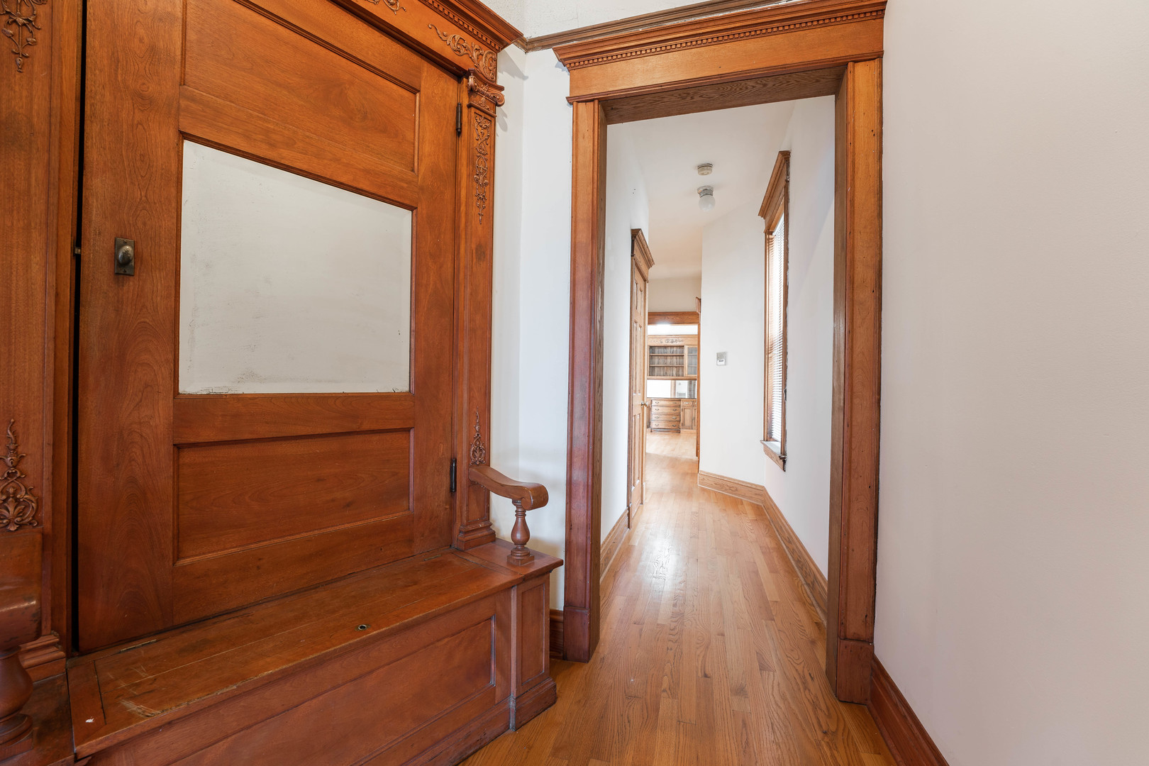 4060 North Sheridan Road, Unit 3S Chicago, IL 60613 - Photo 9 of 15 a view of a hallway with wooden floor and cabinet