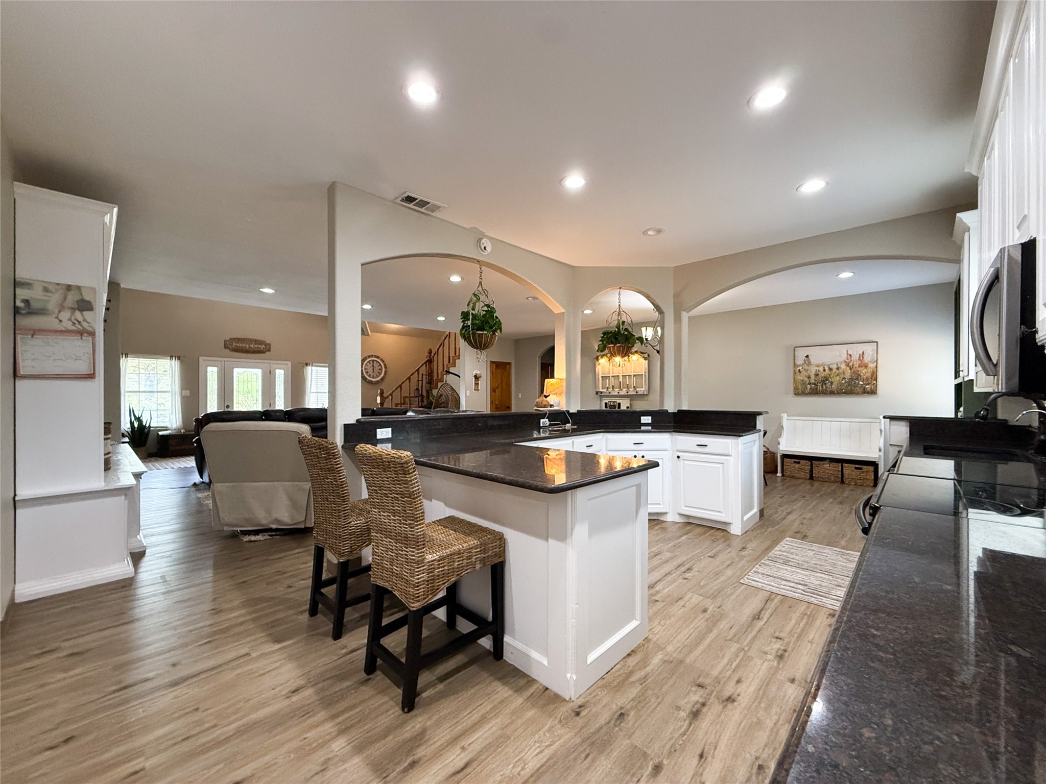 740 Bridget Avenue Buffalo, TX 75831 - Photo 26 of 50 a living room with kitchen island furniture and a wooden floor