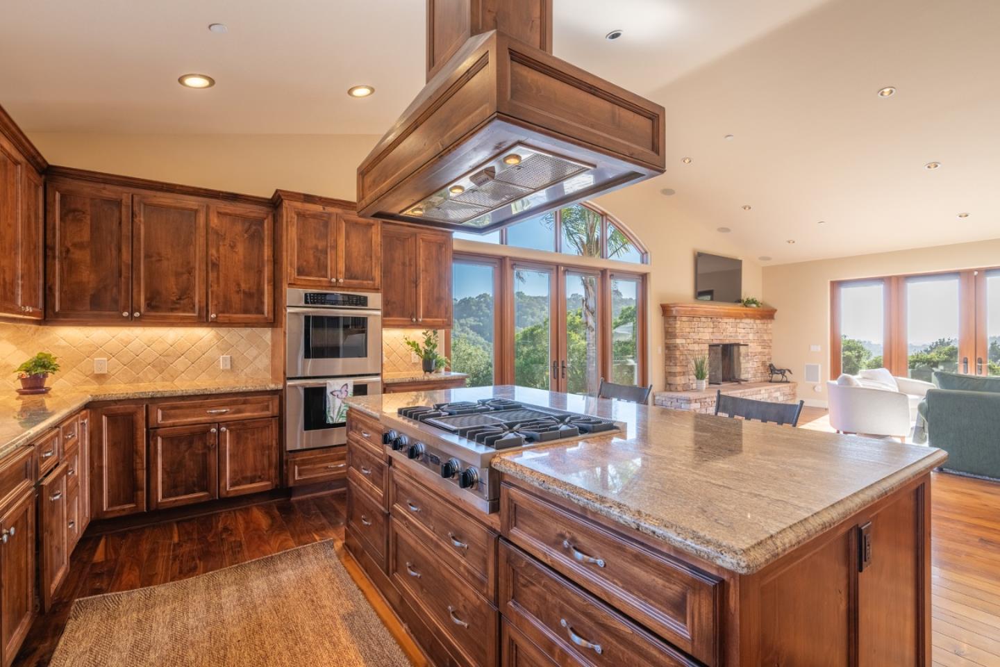 67 Tucker Road Watsonville, CA 95076 - Photo 11 of 32 a kitchen with stainless steel appliances granite countertop a stove and a refrigerator