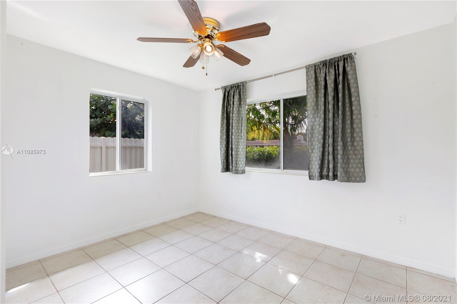 12501 Southwest 84th Avenue Road Miami, FL 33156 - Photo 13 of 20 a view of an empty room with a window