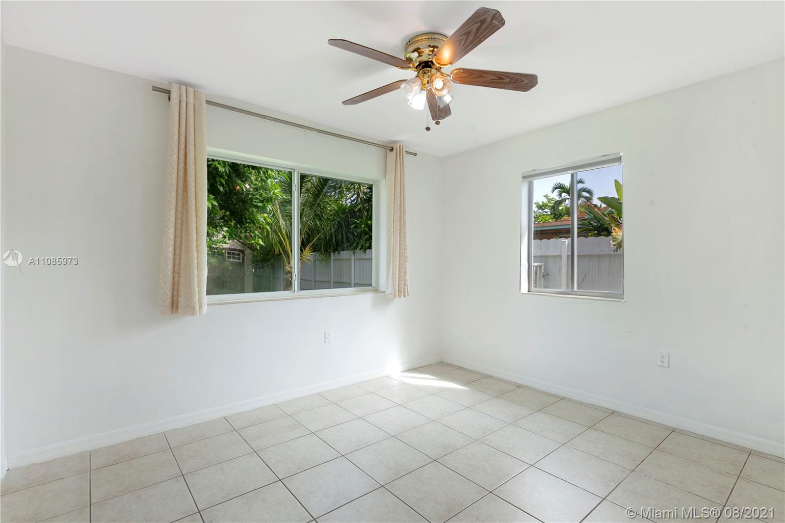 12501 Southwest 84th Avenue Road Miami, FL 33156 - Photo 15 of 20 a view of an empty room with a window