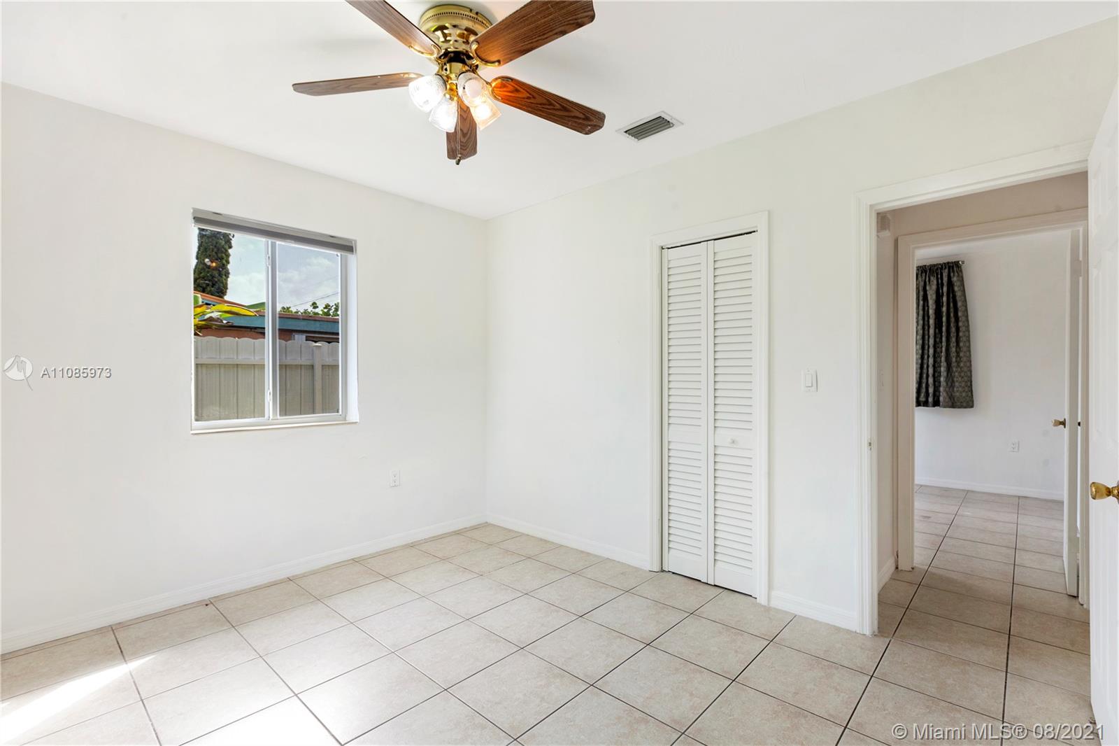 12501 Southwest 84th Avenue Road Miami, FL 33156 - Photo 16 of 20 a view of an empty room and window